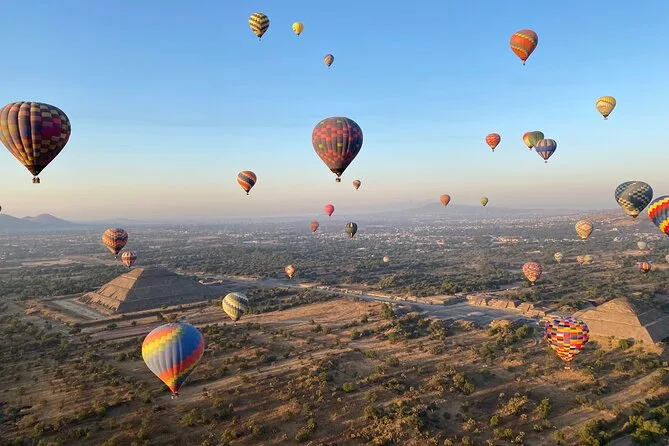 Balloons in a partly cloudy morning sky